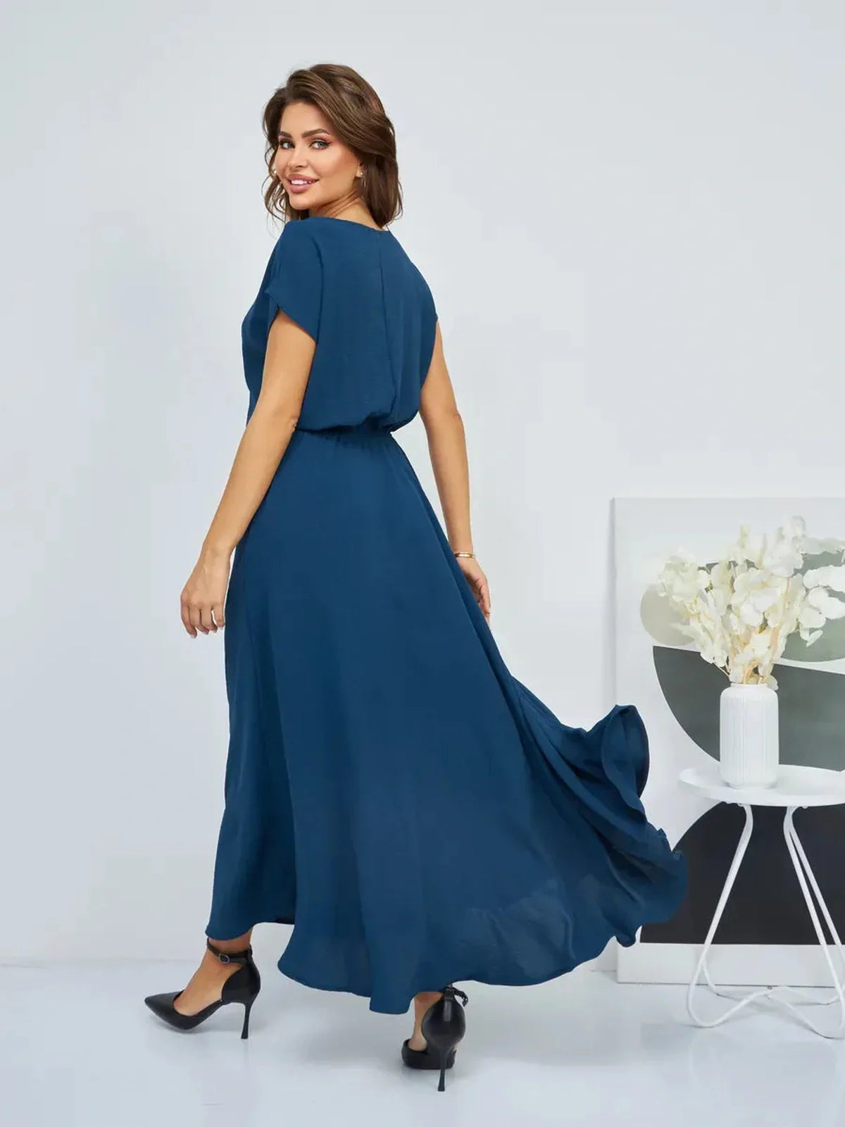 Verona Maxi Dress in deep blue, featuring a flowy silhouette and pockets, perfect for summer elegance.