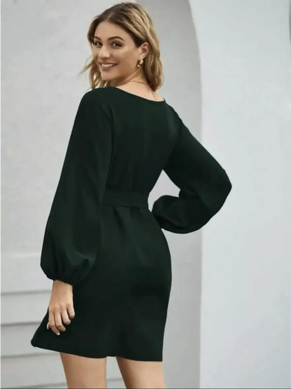 Elegant dark emerald green mini dress with long sleeves, perfect for weddings and special occasions.