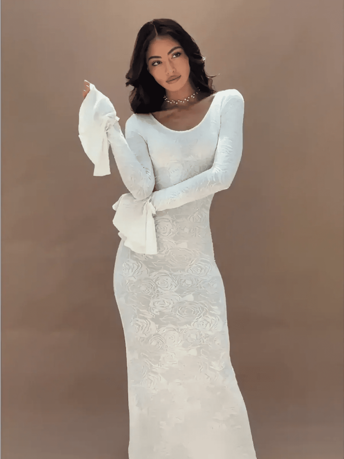 Model showcasing the Floral Elegance Maxi Dress, featuring sculpted fit and flared bell sleeves on a neutral background.