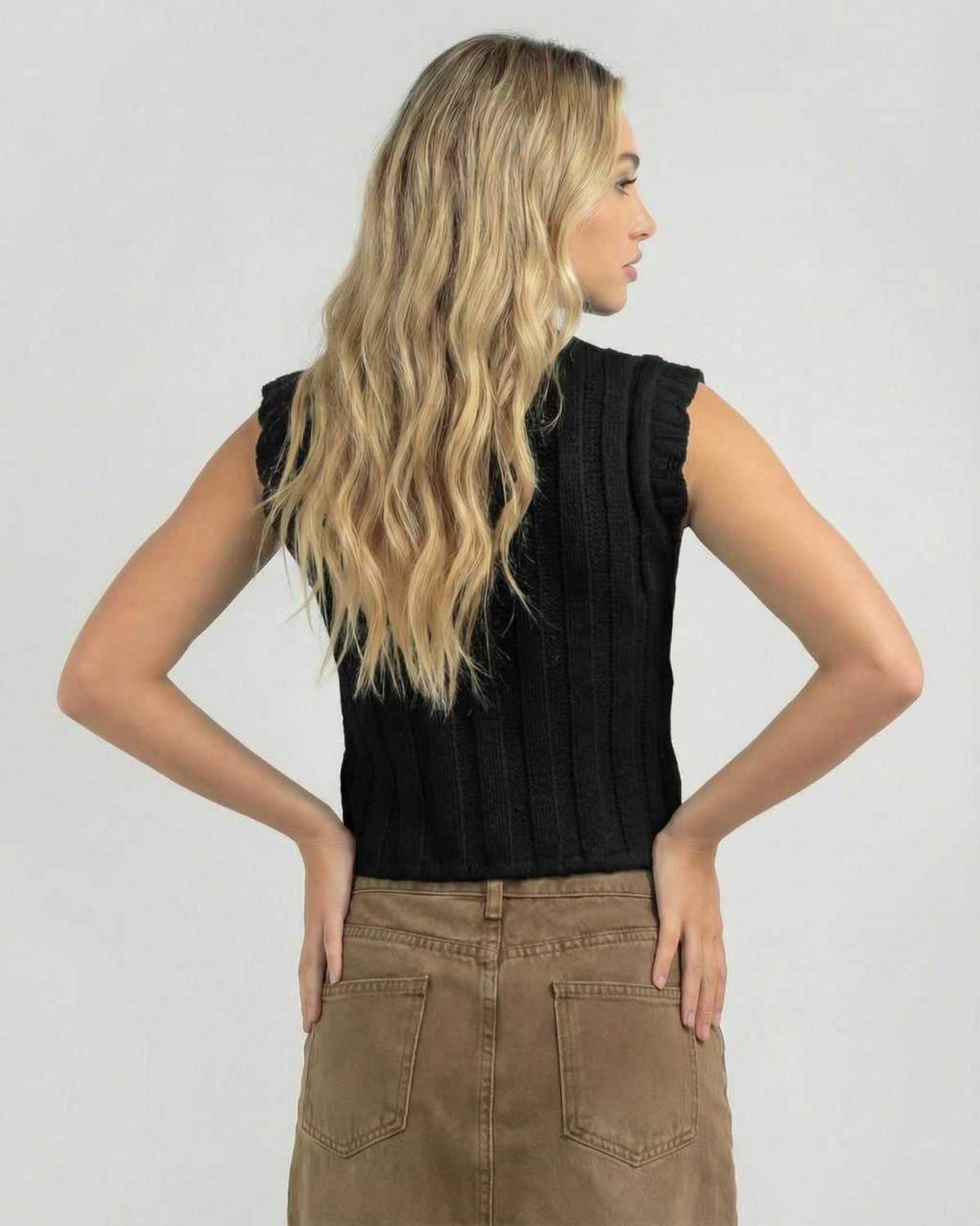 Noiré Top by Lauven – Women's black sleeveless knit top with crew neck, showcasing the back view.
