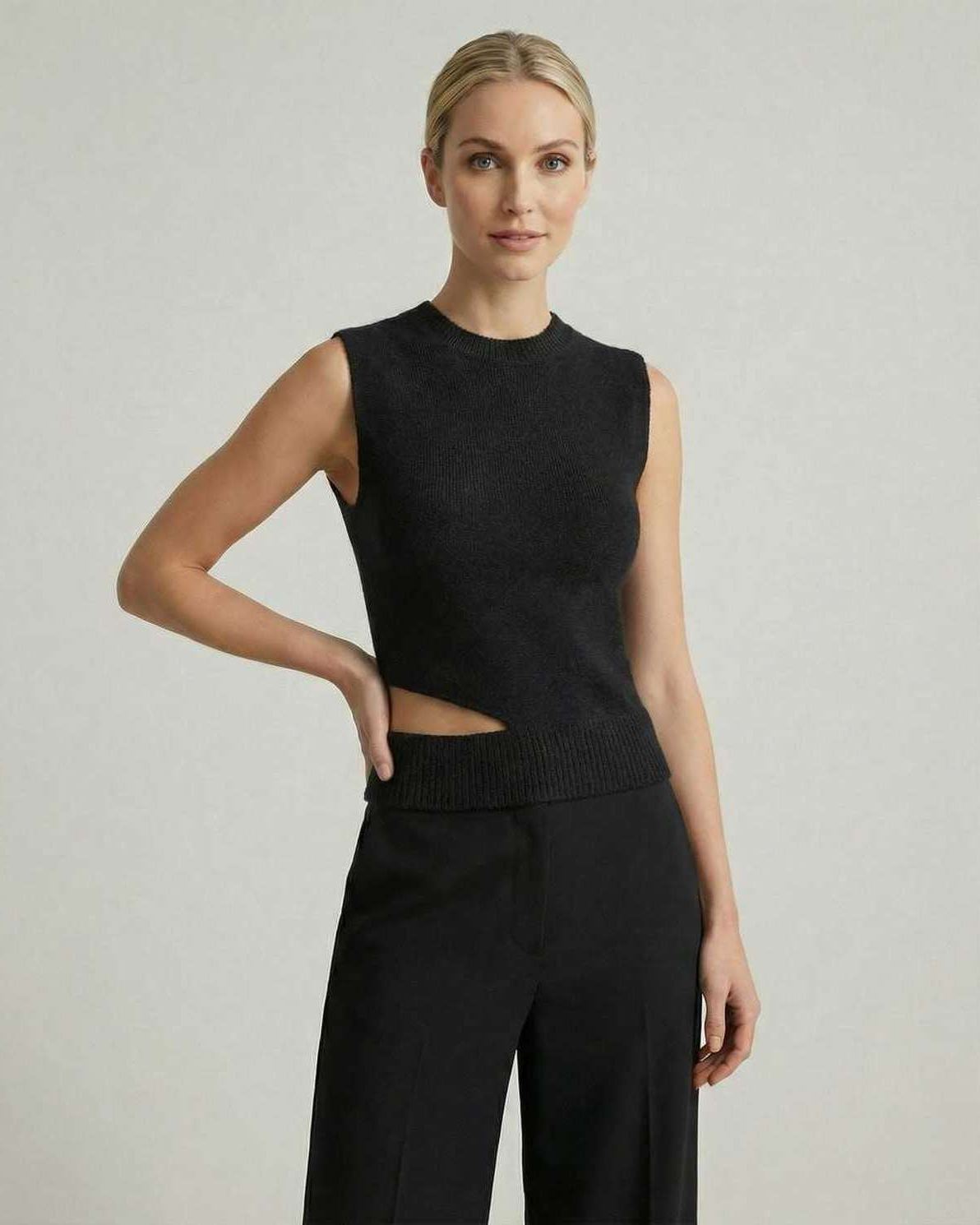 Noiré Top by Lauven, women's black knit sleeveless top with elegant cutout design.