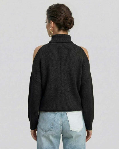 Back view of a woman wearing a Lauven Monaco Sweater, a black turtleneck with cutout shoulders.