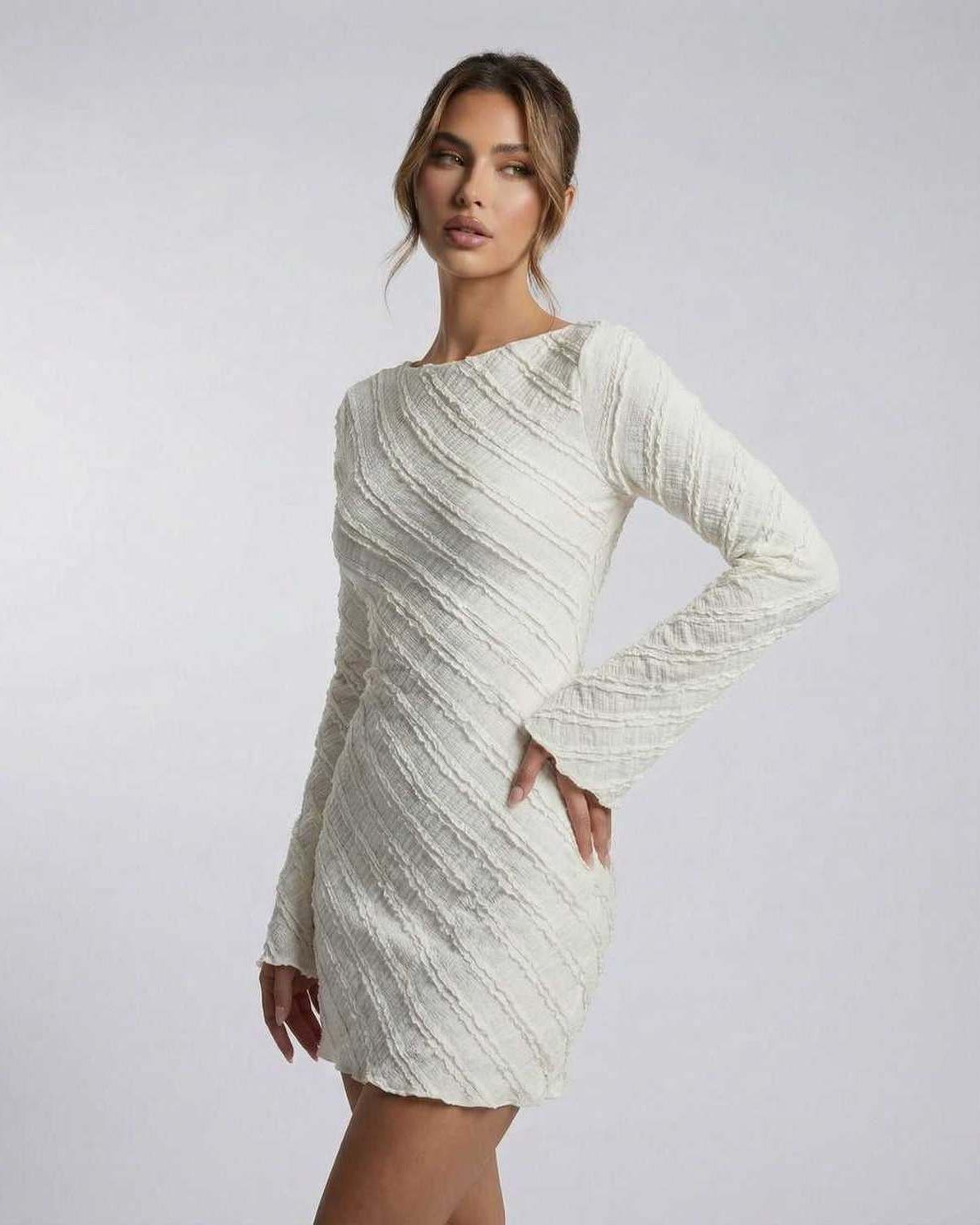 Sienna Mini Dress by Lauven, white long sleeve A-line textured mini dress with a sculpted fit.