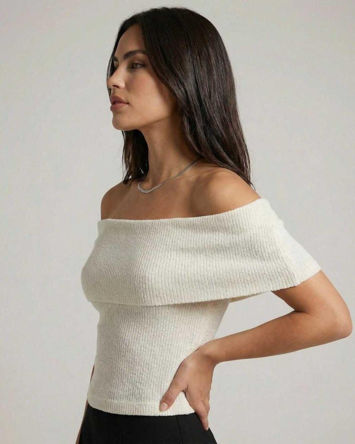 Women wearing Lauven's Monaco Top, an elegant off shoulder knit top in a minimalist style.