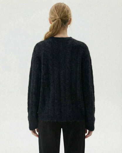 Noiré Pullover by Lauven – Women's black wool blend knit sweater seen from the back.
