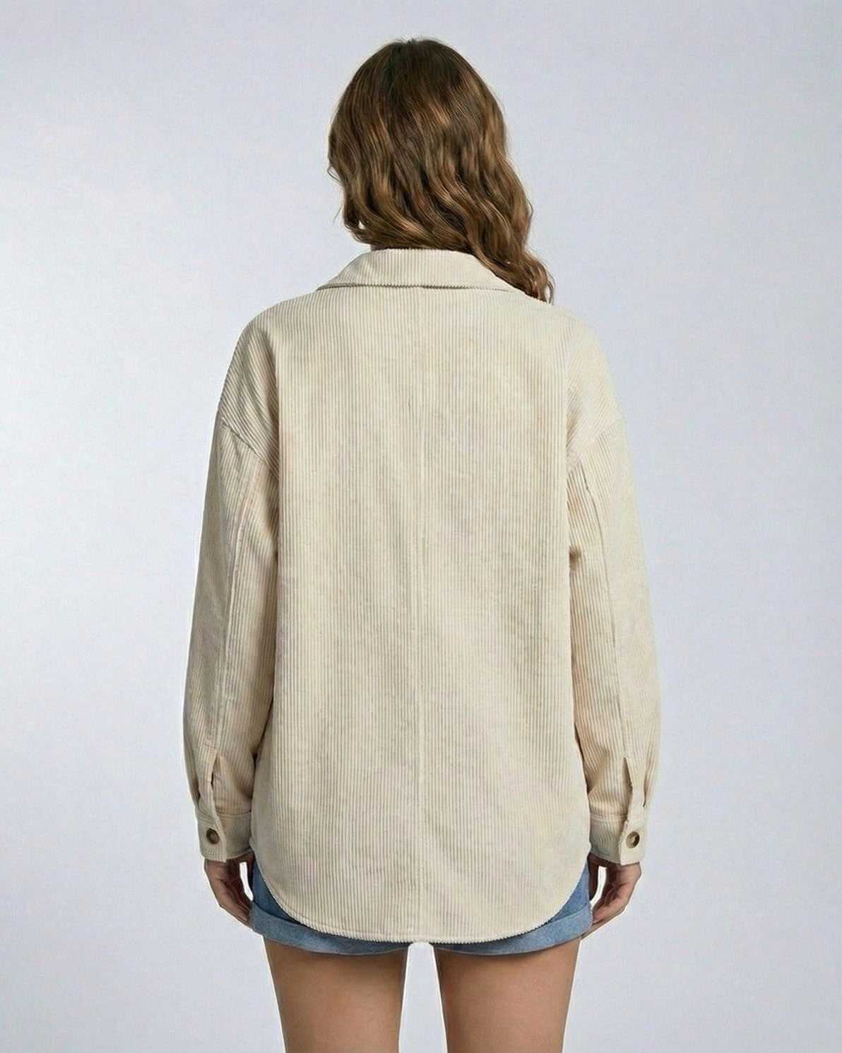 Back view of a woman wearing the Monaco Jacket by Lauven, showcasing its relaxed oversized silhouette in soft corduroy.