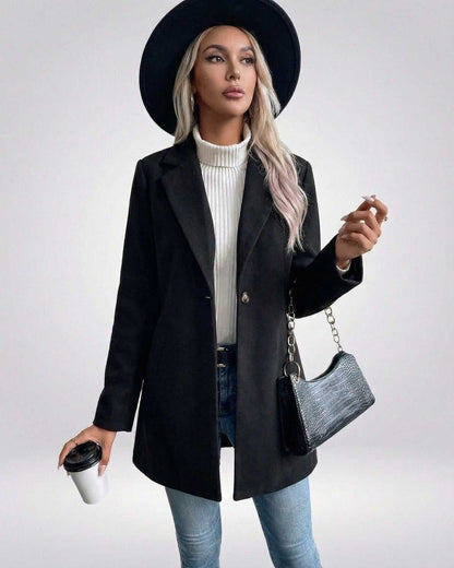 Noiré Jacket by Lauven – Women’s Black Plaid Slim Fit Jacket styled with a hat and handbag.