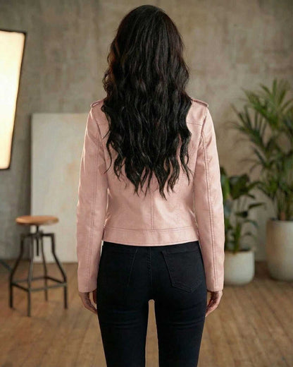 Back view of a model wearing the Rosé Jacket by Lauven, a women’s pink leather moto jacket in a slim fit style.
