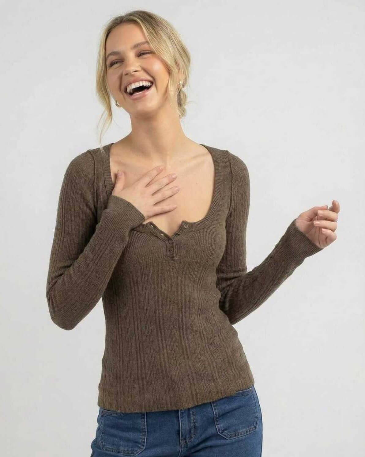 Woman laughing in Monaco Long Sleeve brown ribbed knit shirt by Lauven.