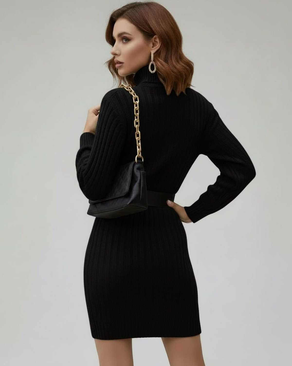Model wearing the Lauven Monaco Mini Dress, a black ribbed long sleeve turtleneck mini dress, showcasing a sleek back view.