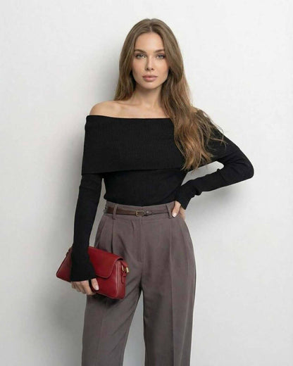 Monaco Top by Lauven – Women's Off-The-Shoulder Long Sleeve Slim Fit Top in Solid Black, stylish outfit with red handbag.