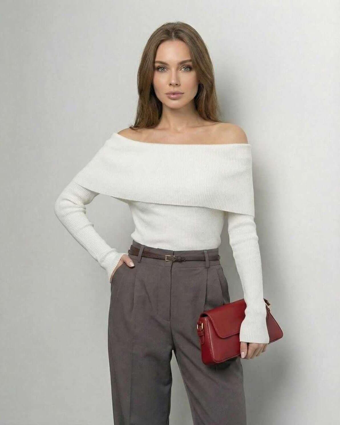 Milano Top by Lauven – Women’s off-the-shoulder long sleeve top in solid white, styled with high-waisted trousers and a red bag.