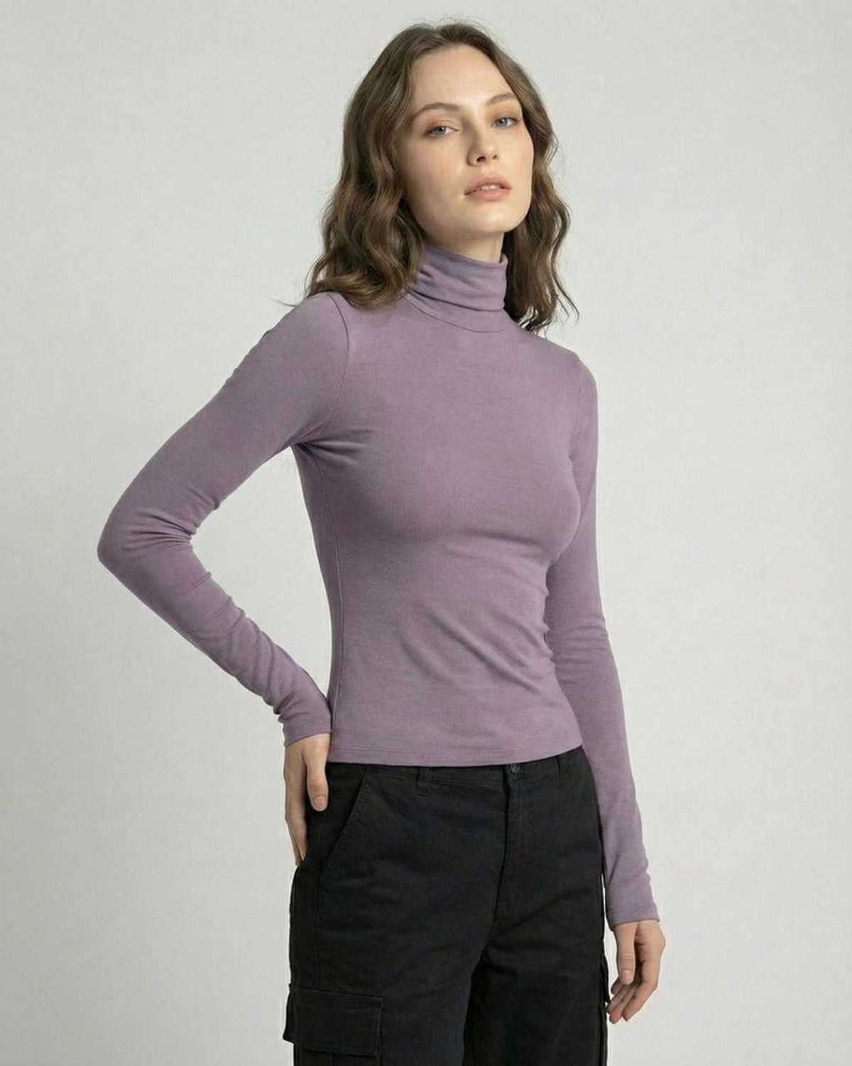Model wearing a sleek Lilac Nova Long Sleeve top by Lauven, showcasing a high round neckline and long sleeves.