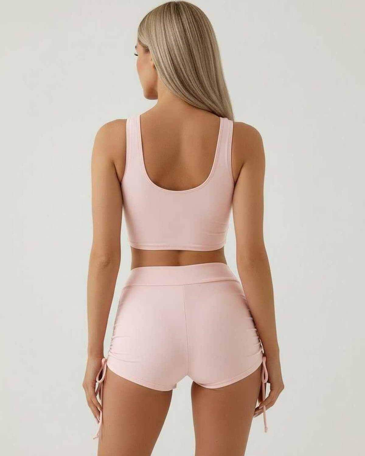 Back view of model wearing Lauven Roselle Set - elegant blush women's two-piece set with sleeveless crop top and high waist shorts.