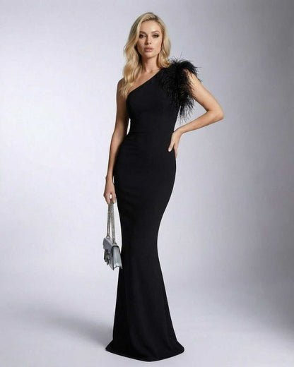 Noirelle Maxi Dress by Lauven, featuring one shoulder feather detail and mermaid silhouette in black.