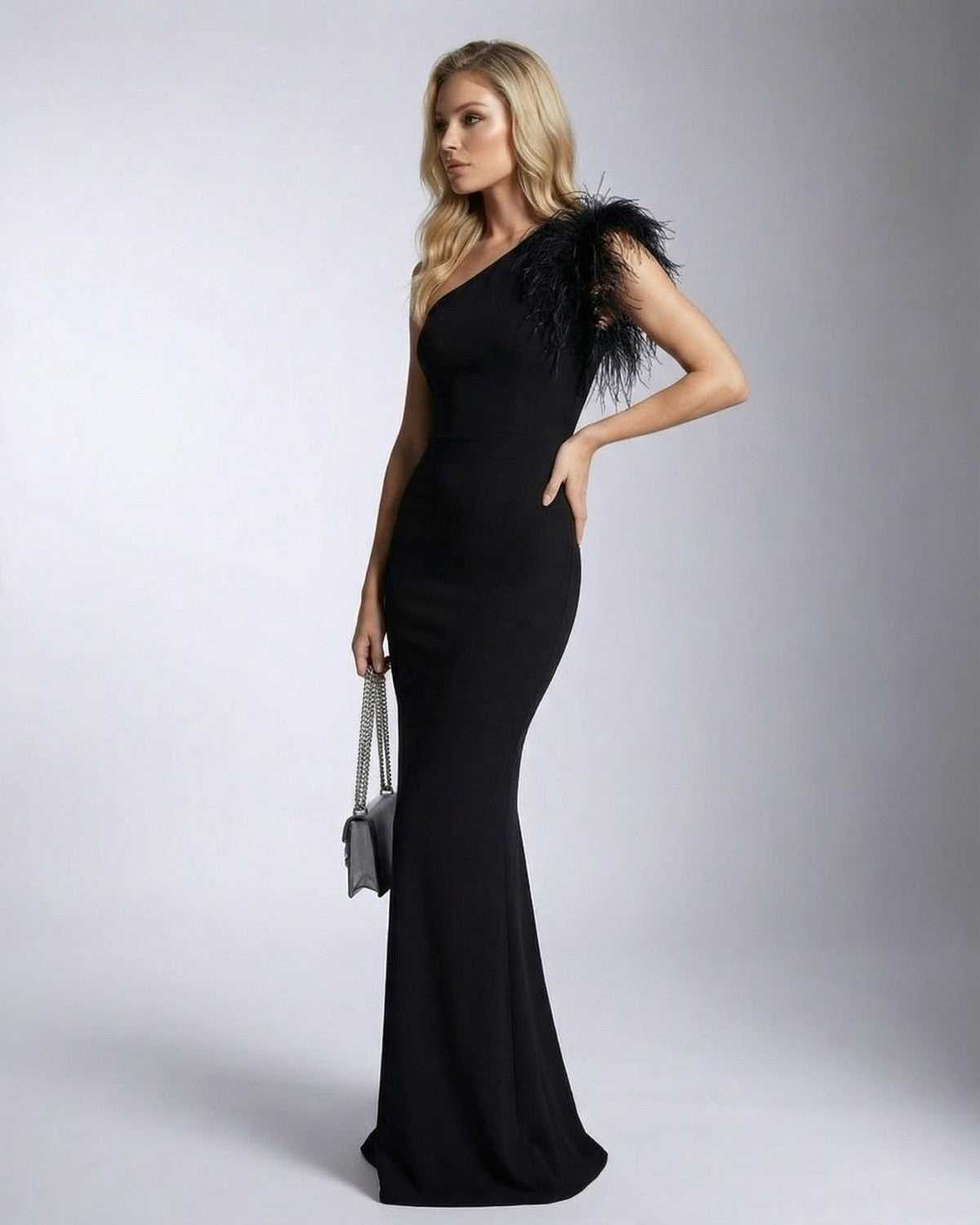 Elegant Noirelle Maxi Dress by Lauven featuring one shoulder feather detail and mermaid silhouette.