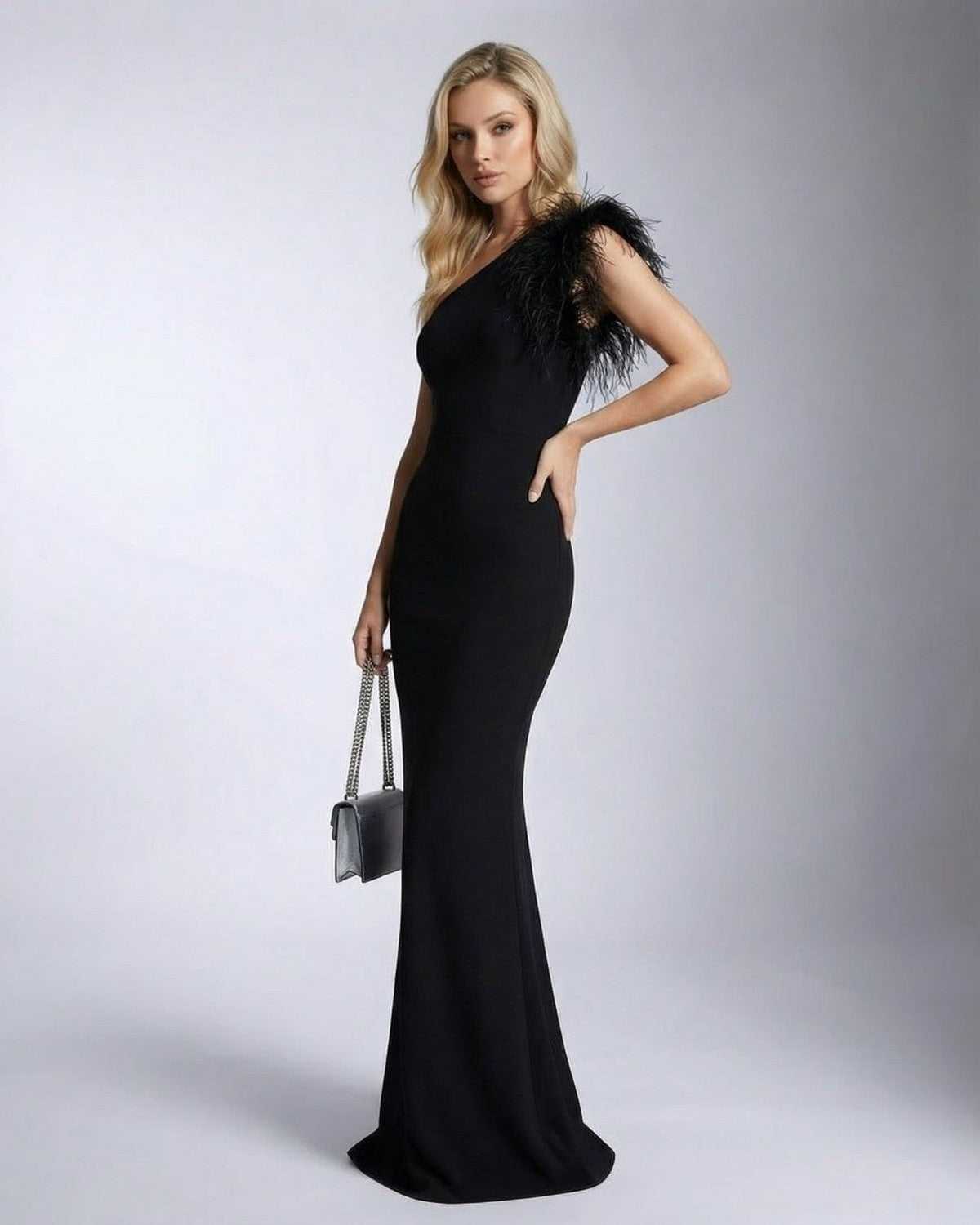 Lauven Noirelle Maxi Dress featuring a one shoulder feather detail mermaid silhouette dress in black.