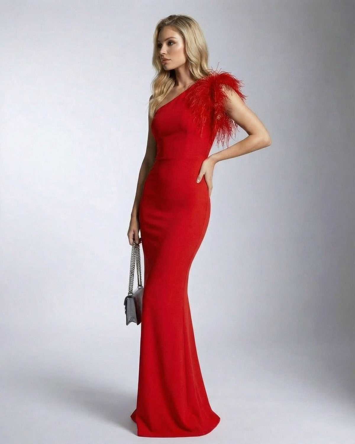 Scarletia Maxi Dress by Lauven in red with one shoulder feather detail and a mermaid silhouette.