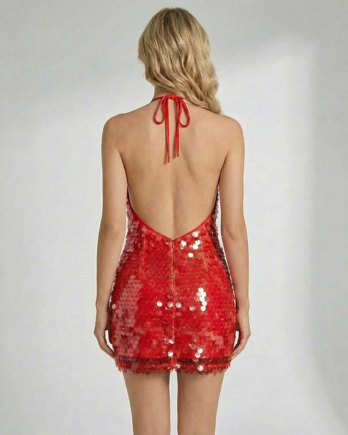 Back view of the Scarlet Mini Dress by Lauven, showcasing its red sequin halter design and bodycon silhouette.