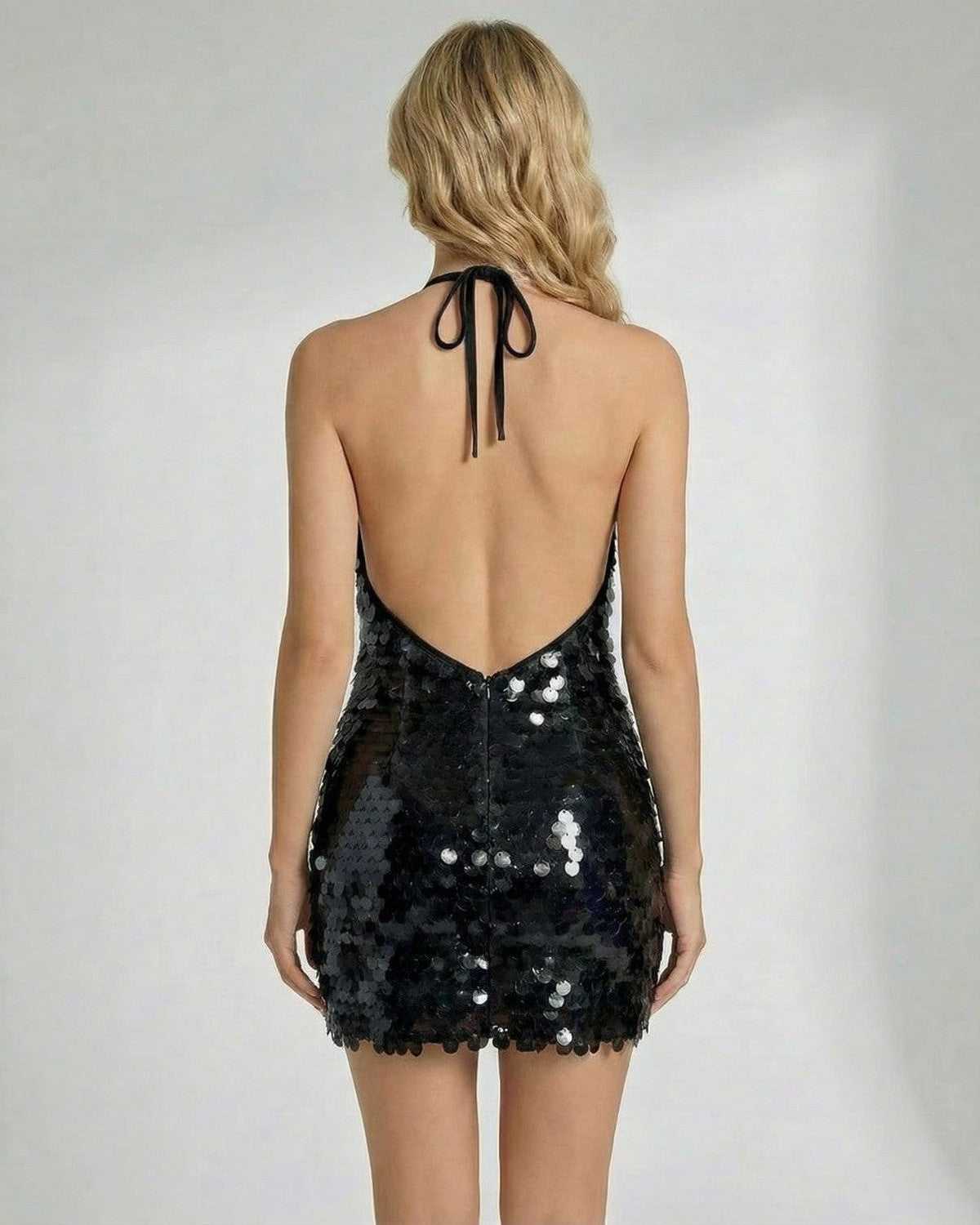 Noir Mini Dress by Lauven, featuring a backless design and black sequins on a halter bodycon silhouette.