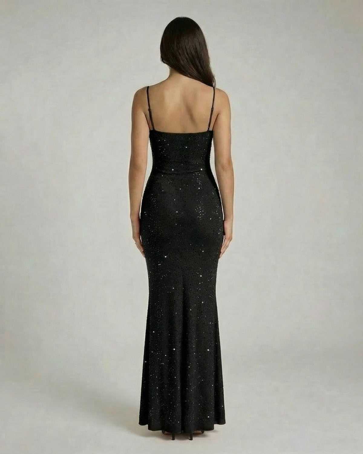 Noir Maxi Dress by Lauven, showcasing a sleek sequin bodycon silhouette with spaghetti straps from the back view.