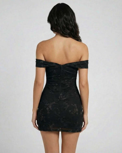 Noir Mini Dress by Lauven, back view showcasing the off-the-shoulder design and jacquard fabric.