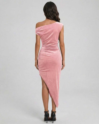 Back view of Blush Midi Dress by Lauven, showcasing the pink velvet fabric and asymmetrical design.