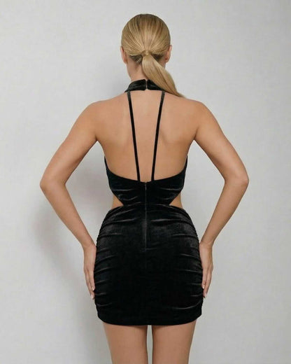 Back view of Lauven Noir Mini Dress showcasing the black velvet bodycon design and sleeveless halter neck style.