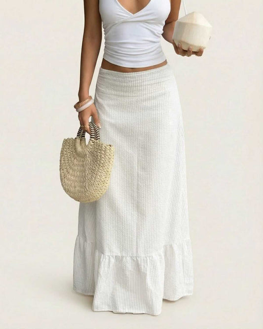 Woman modeling Alba Maxi Skirt by Lauven, featuring a flared silhouette and soft striped texture.