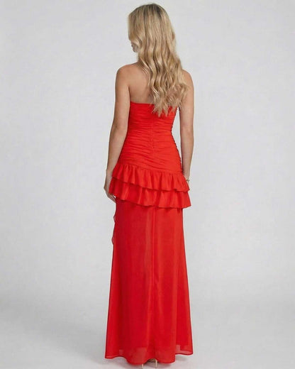 Valencia Maxi Dress by Lauven, showcasing a back view with layered ruffles and ruching in bold red.