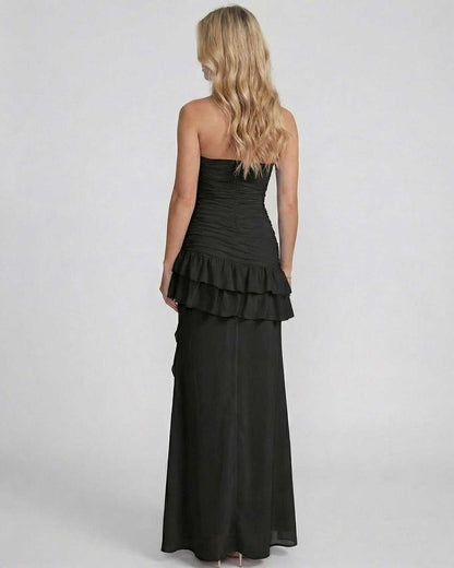 Noiré Maxi Dress by Lauven, showcasing a back view with ruffle detailing and a sleek silhouette.