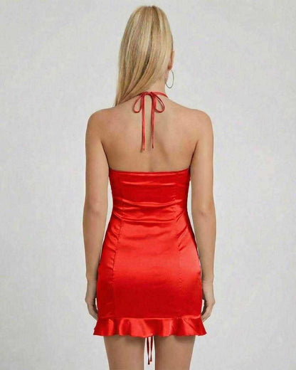 Back view of the Scarlet Mini Dress by Lauven, showcasing satin finish and ruched design in vibrant red.
