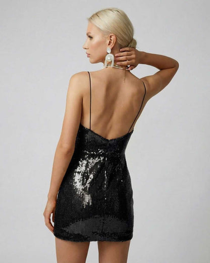 Nocturne Mini Dress by Lauven, showcasing a black sequin draped V-neck design from the back.