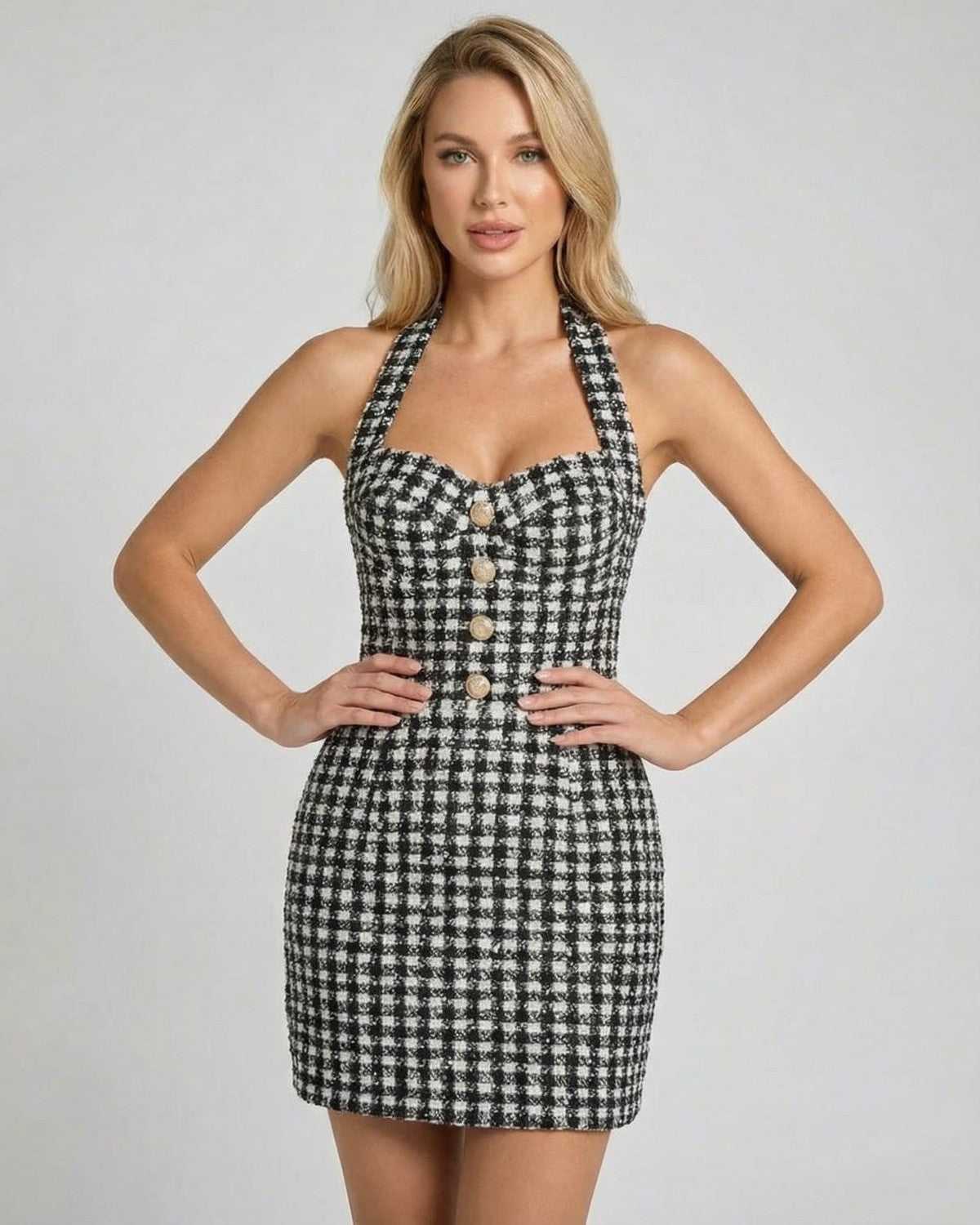 Aurelia Mini Dress by Lauven, a halter neck plaid A-line mini dress featuring a structured silhouette and button detail.