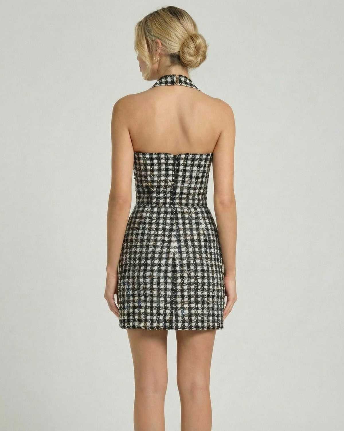 Aurelia Mini Dress by Lauven showcasing a halter neck and A-line silhouette with a chic plaid pattern.