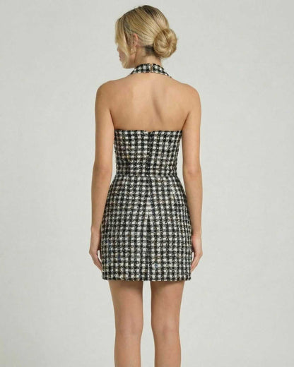 Aurelia Mini Dress by Lauven showcasing a halter neck and A-line silhouette with a chic plaid pattern.