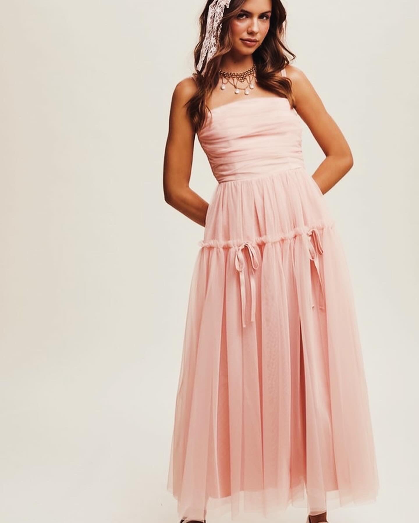 Elegant Aurora Maxi Dress in soft pink with mesh overlay, perfect for summer and wedding guest occasions.