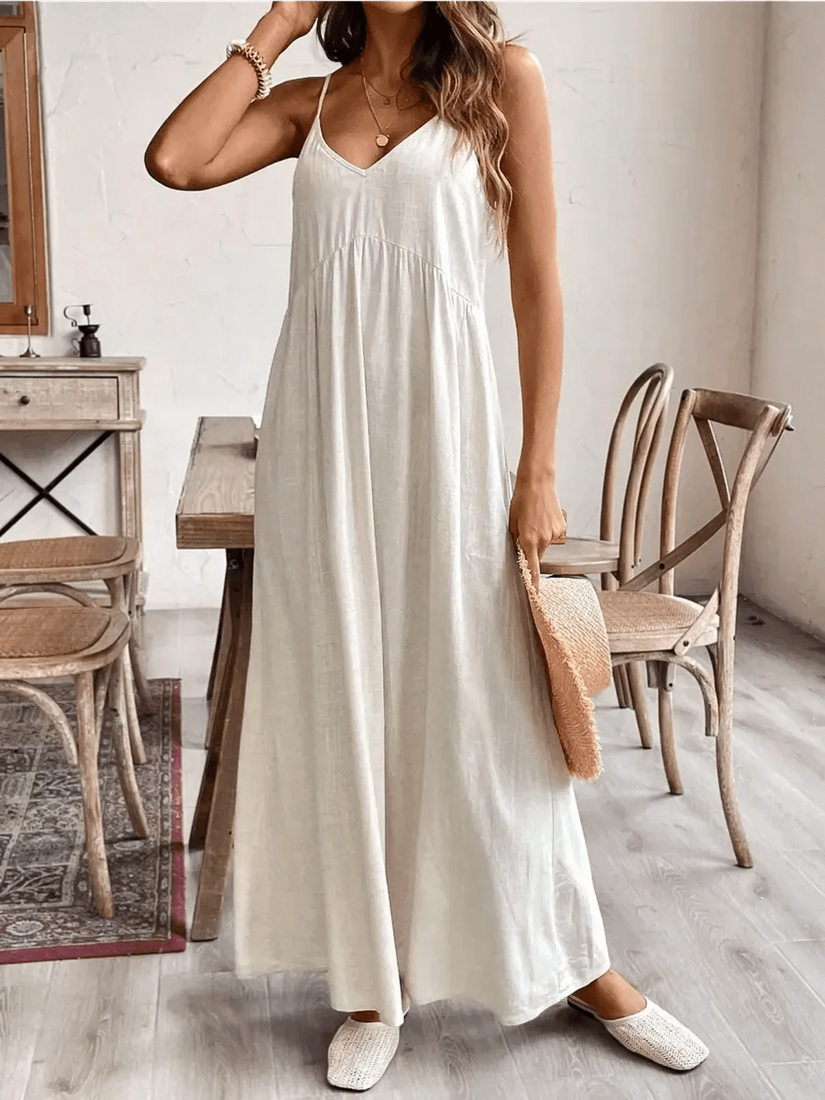 Woman wearing Serenity Maxi Dress in lightweight fabric, showcasing elegant V-neckline and relaxed fit, perfect for summer.