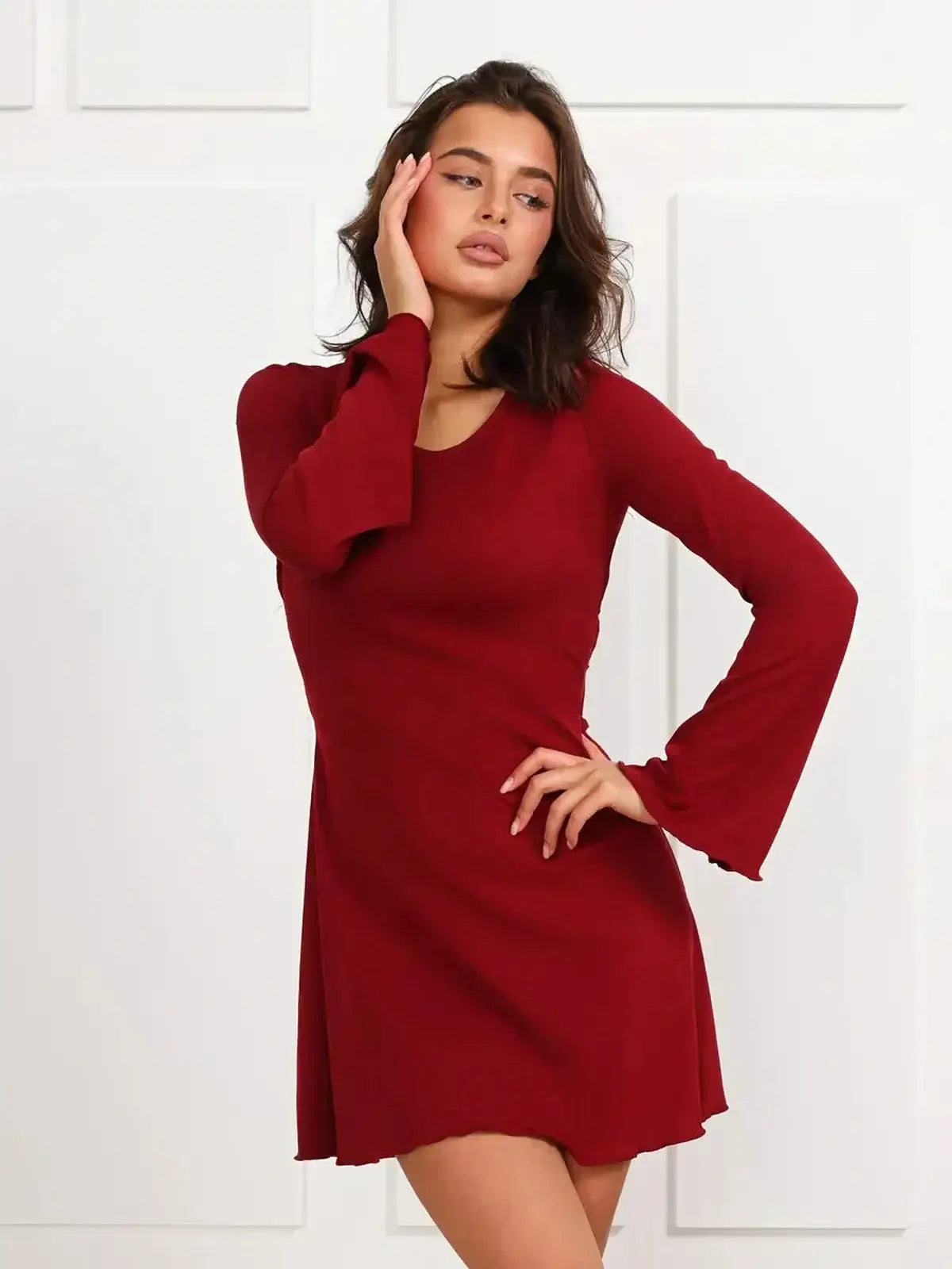 Ruby Laced red mini dress with long bell sleeves, perfect for parties and special occasions.