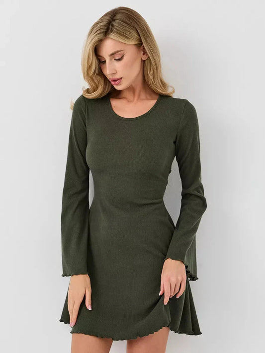 Model wearing the Ivy Bell sculpting mini dress with flared bell sleeves in an olive green shade.