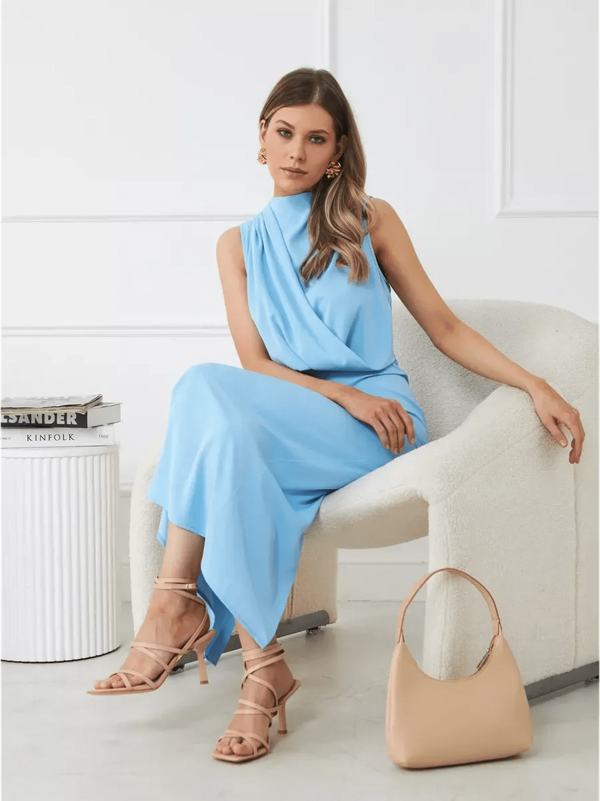 Model wearing the Sculpted Grace Maxi Dress in light blue, showcasing its sleek draped silhouette and elegant style.