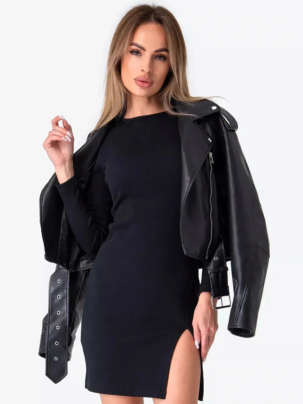 Model wearing a fitted black mini dress with a stylish leather jacket, showcasing a chic party look.