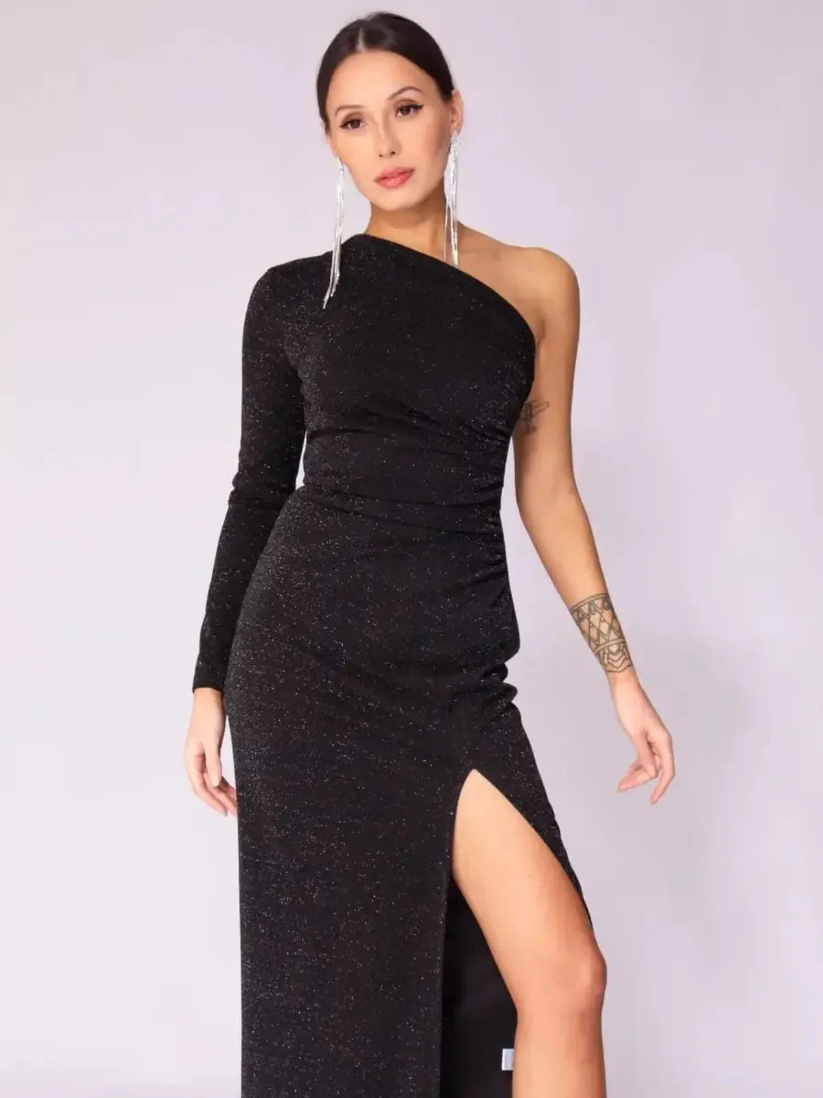 Luna Noir Maxi Dress featuring a one-shoulder design, drape, and a daring leg slit for evening elegance.