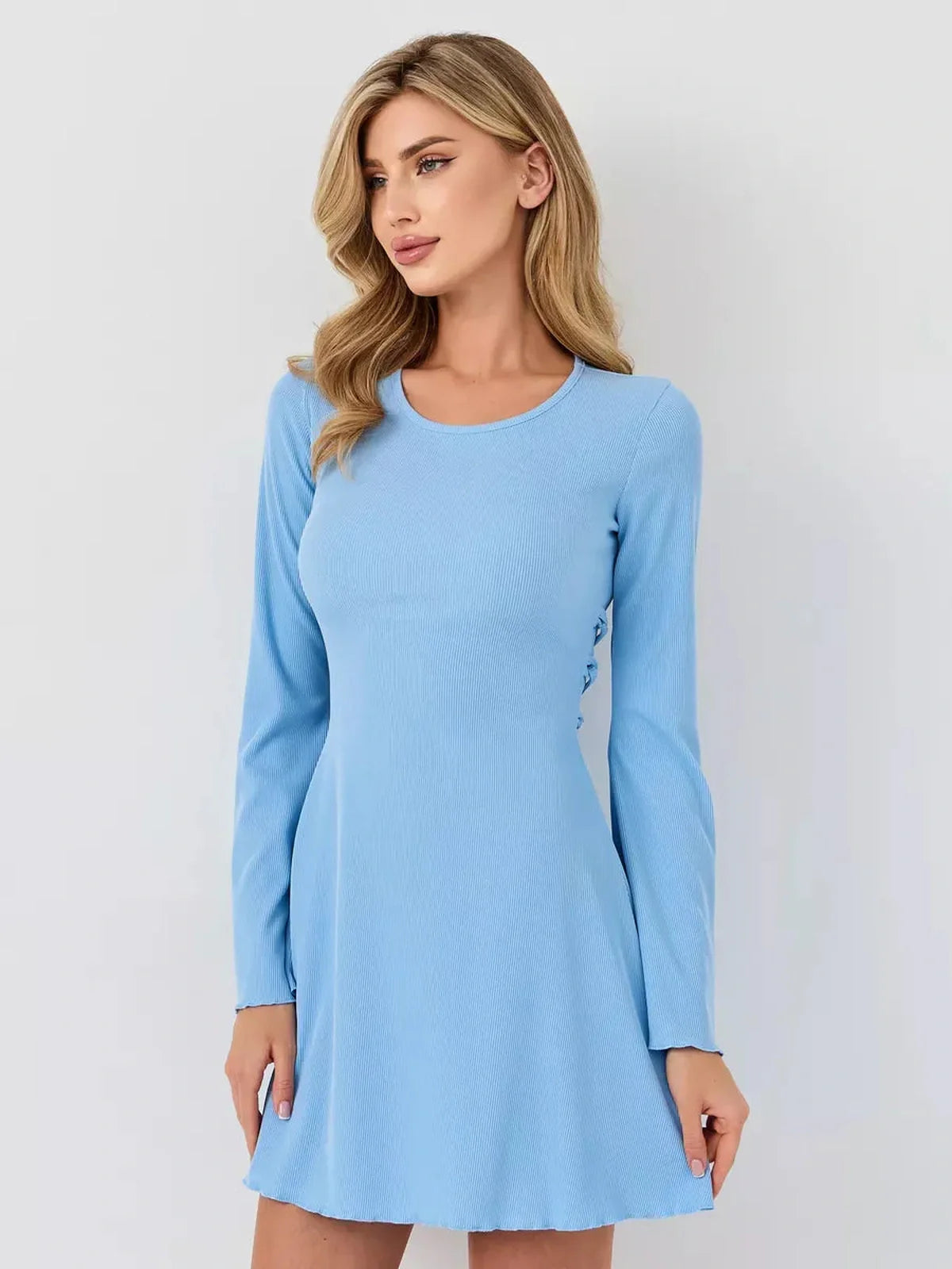Pastel blue ribbed knit mini dress with long fluted sleeves and flared hem, perfect for summer celebrations.