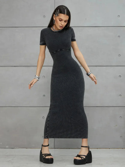 Graphite Form Maxi Dress featuring a sculpted fit and urban edge, styled with bold platform heels.