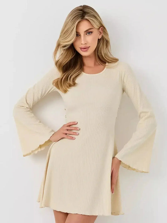 Model wearing an ivory flare long sleeve mini dress with ribbed texture and bell sleeves, perfect for wedding or cocktail events.
