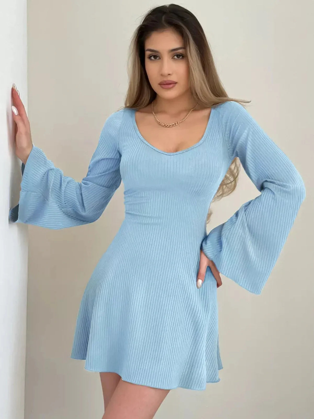 Sky Flare blue mini dress with ribbed knit fabric and flared sleeves, perfect for summer occasions.