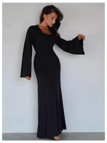 Noir contour maxi dress with flared sleeves, accentuating silhouette, ideal for formal events and summer occasions.