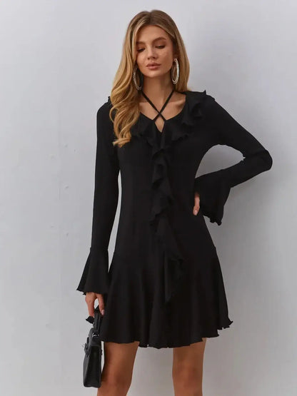 Velvet Noir black dress with ruffles and V-neckline, perfect for weddings and summer parties.