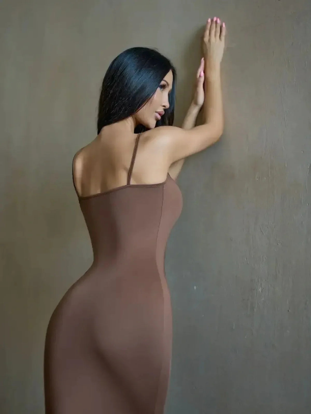 Cocoa Curve Maxi Dress in deep brown, showcasing a fitted design that flatters the female silhouette.